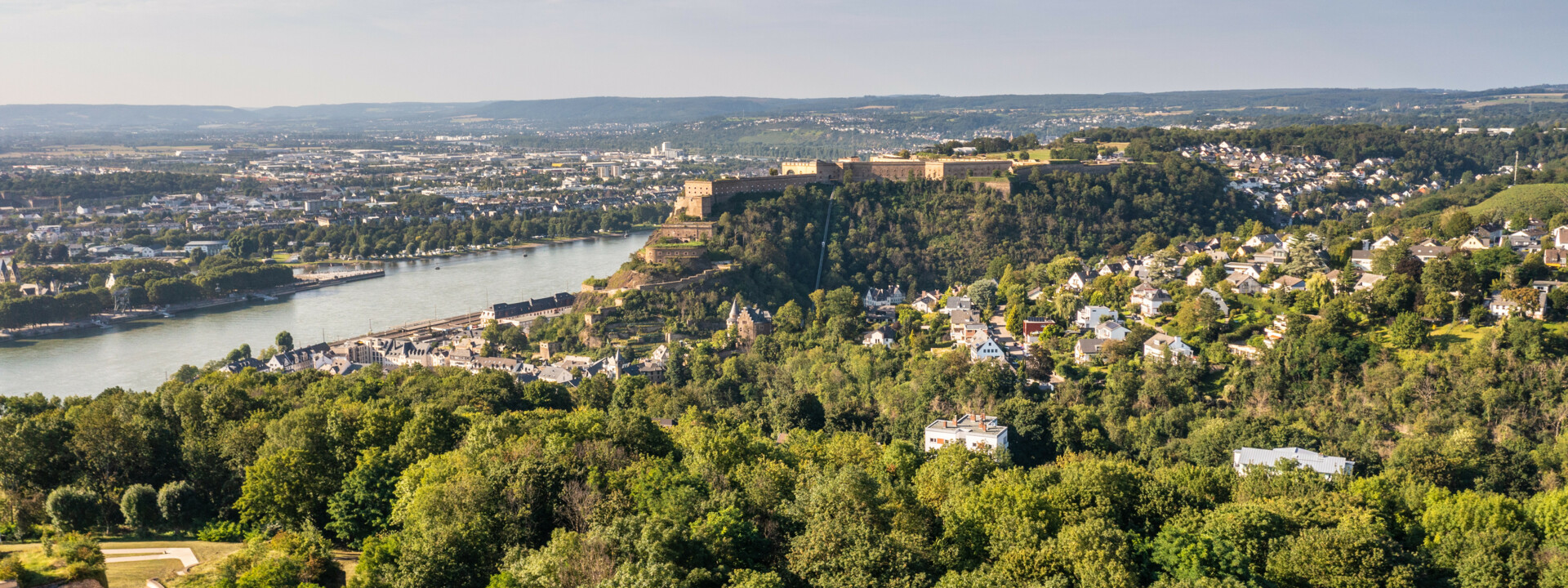 Koblenz, Germany. 30th Apr, 2020. Ehrenbreitstein Fortress, the largest  part of the major Koblenz fortress, is situated high above the Rhine with a  view of the city and the Deutsches Eck at